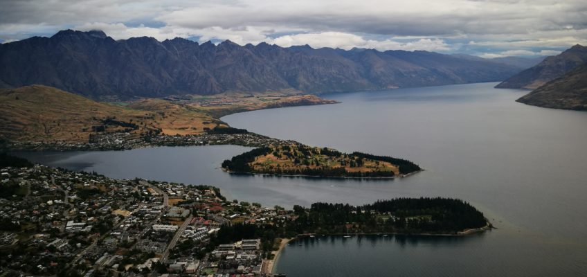 Queenstown and lake wakatipu from Skyline gondola with mountain background and cloudy sky