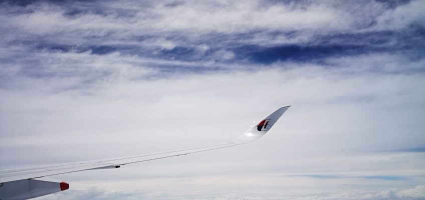 Malaysia airline winglet high above sky