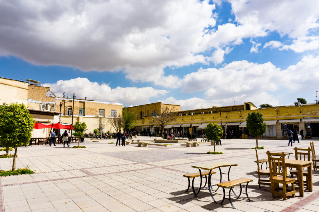 outside of vakil bazaar with empty benches and few coffee shops